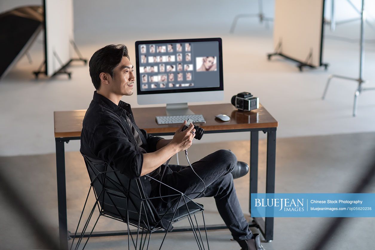Chinese photographer in studio