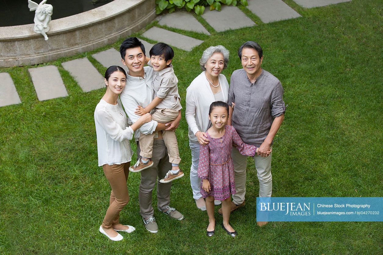 Happy Chinese family looking up