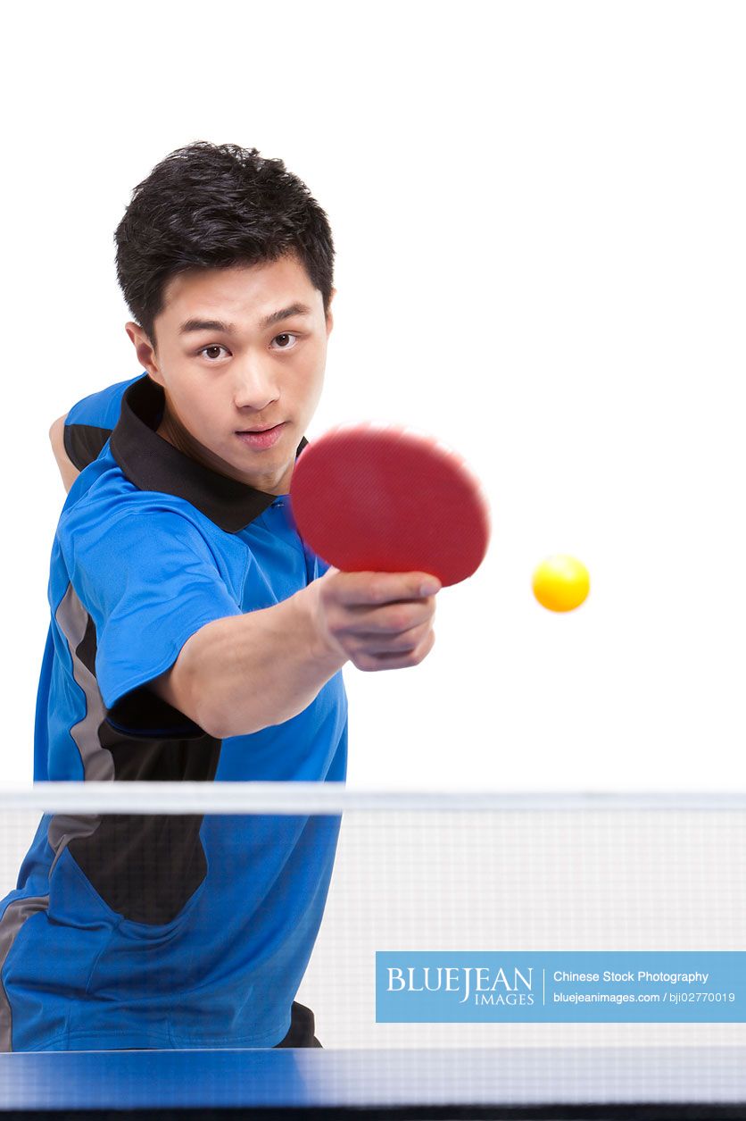 Chinese table tennis player hitting ball