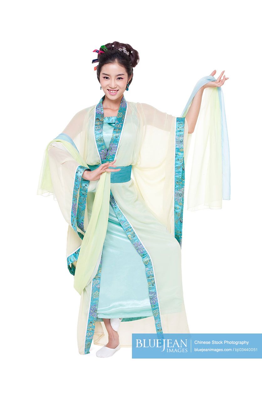 Young Chinese woman in traditional Chinese costume performing traditional dancing