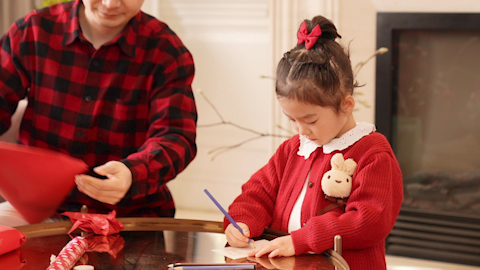 Family joyfully celebrating Chinese New Year together