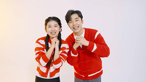 Happy young Chinese couple celebrating Chinese new year