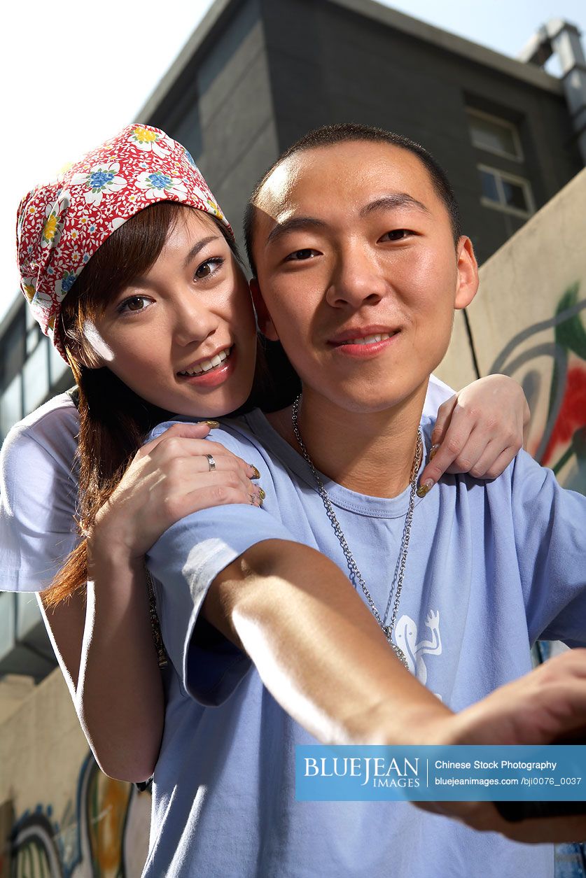 Chinese teenage boy and girl on bike