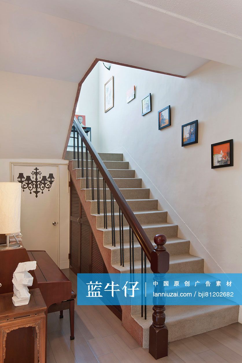 Picture frames mounted on wall along stairways at home