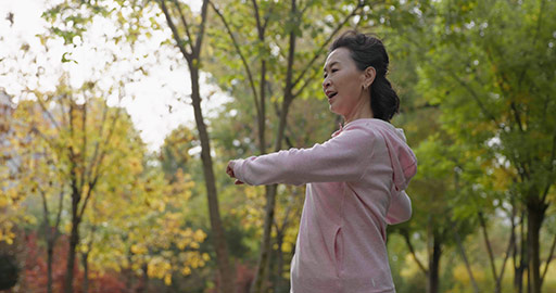 Happy senior Chinese woman exercising in the park,4K