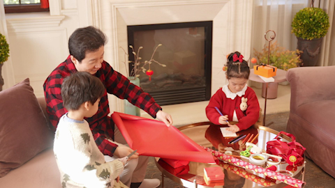 Family joyfully celebrating Chinese New Year together