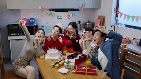 Young friends celebrating a birthday together