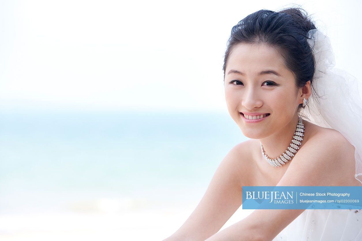 Portrait of happy Chinese bride