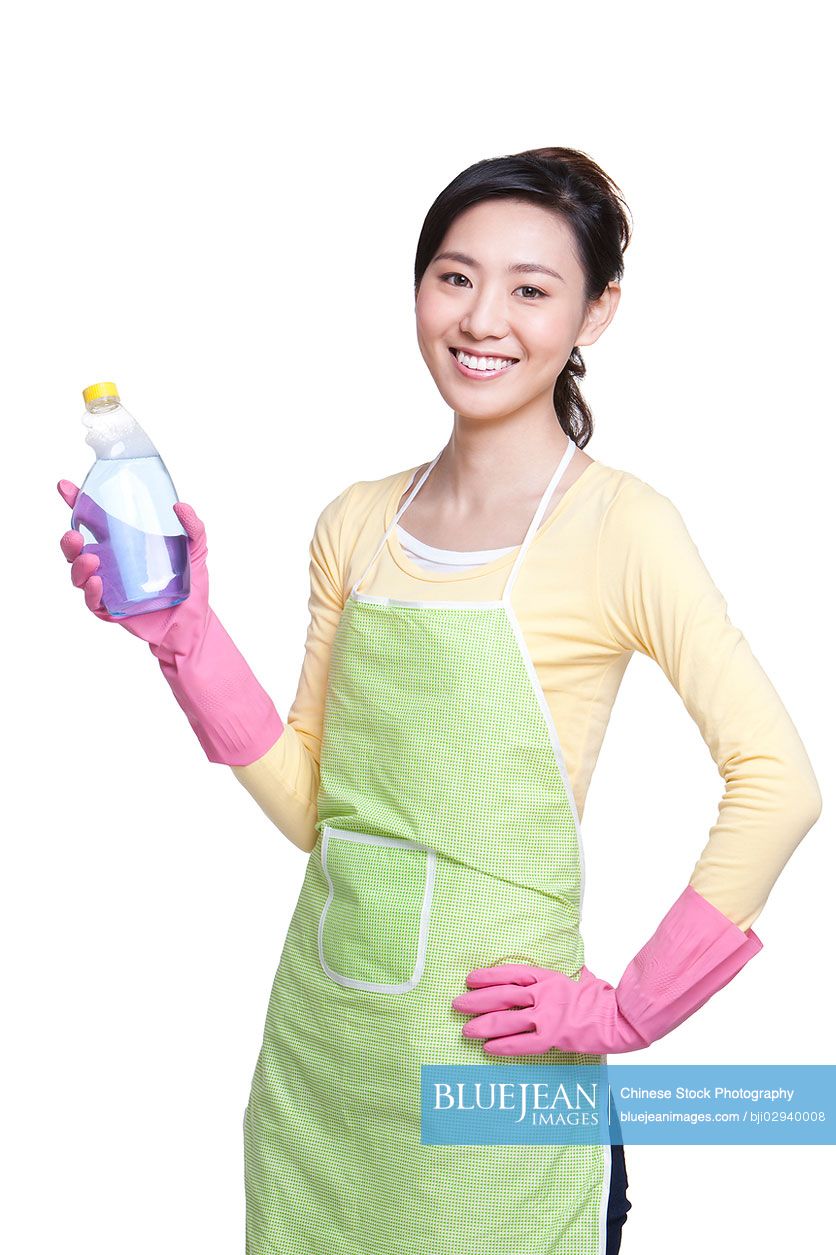 Chinese housewife with cleaning product