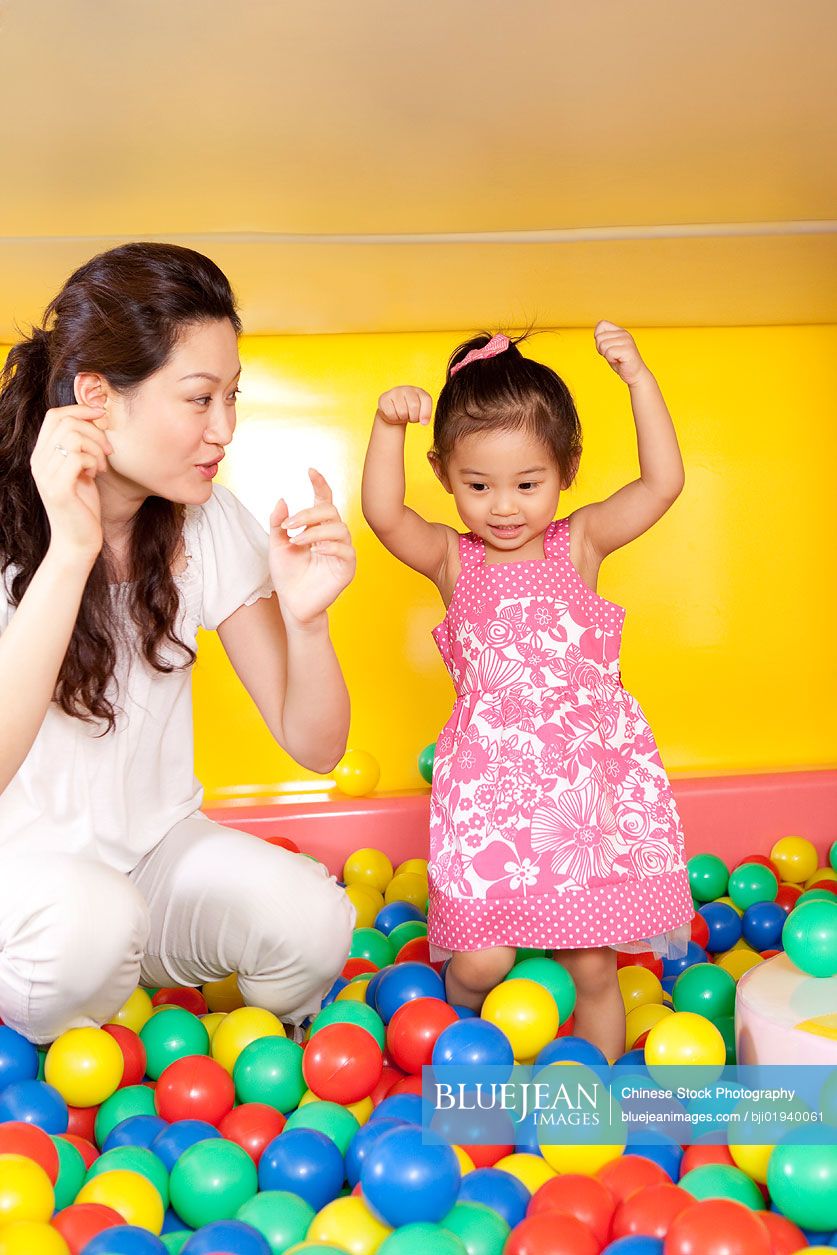 Chinese mother playing with daughter