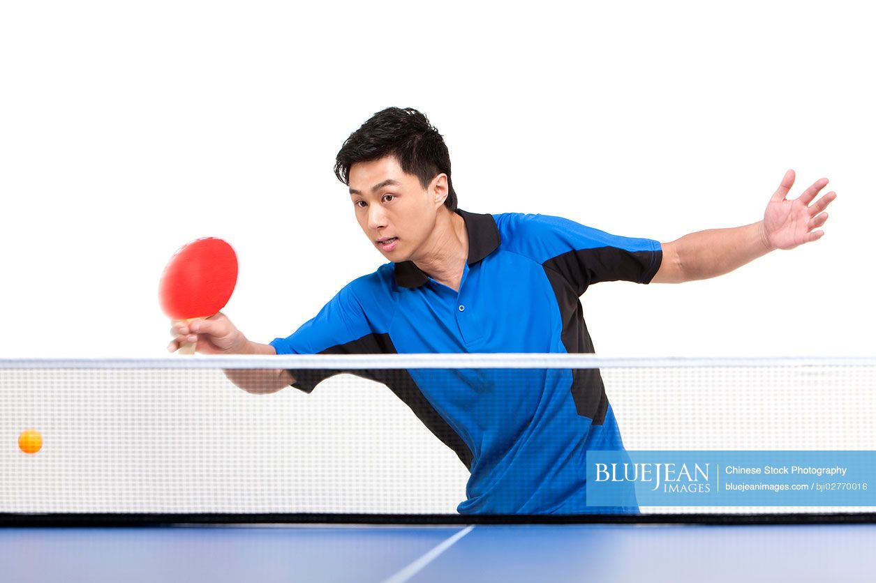 Chinese table tennis player hitting ball