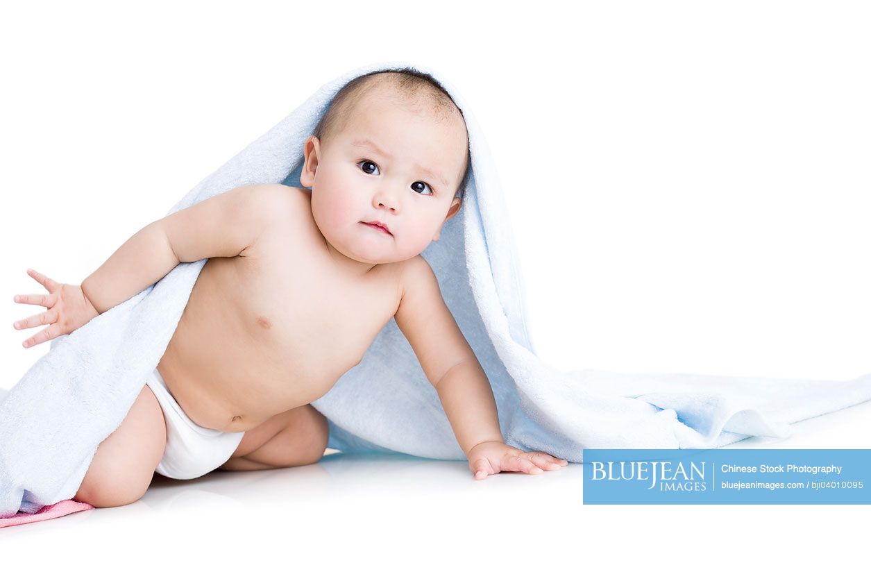 Cute Chinese baby boy wrapped in towel