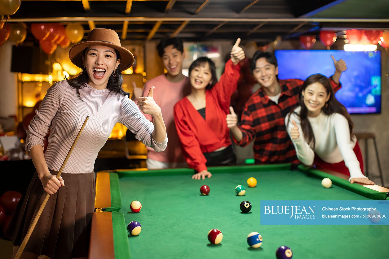 Friends play billiards., Stock image