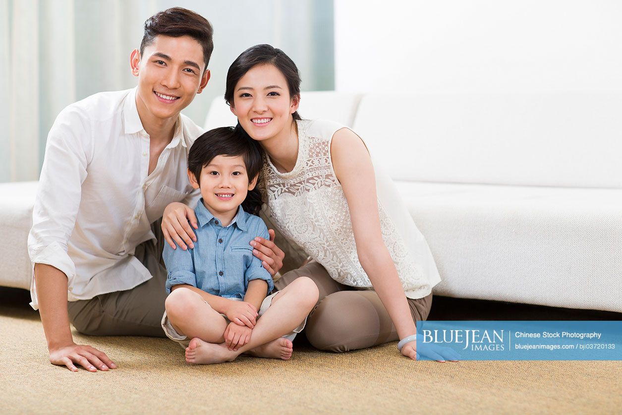 Happy Chinese family in living room