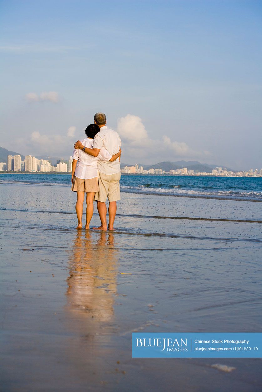 Portrait of senior Chinese couple on the beach