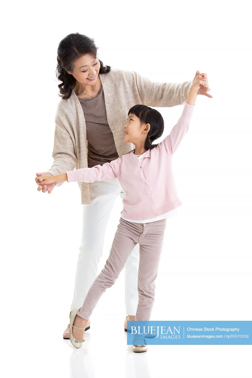 Happy Chinese grandmother and granddaughter