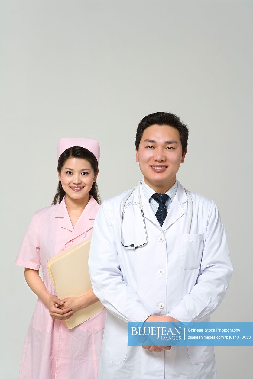 Chinese doctor with nurse in pink uniform