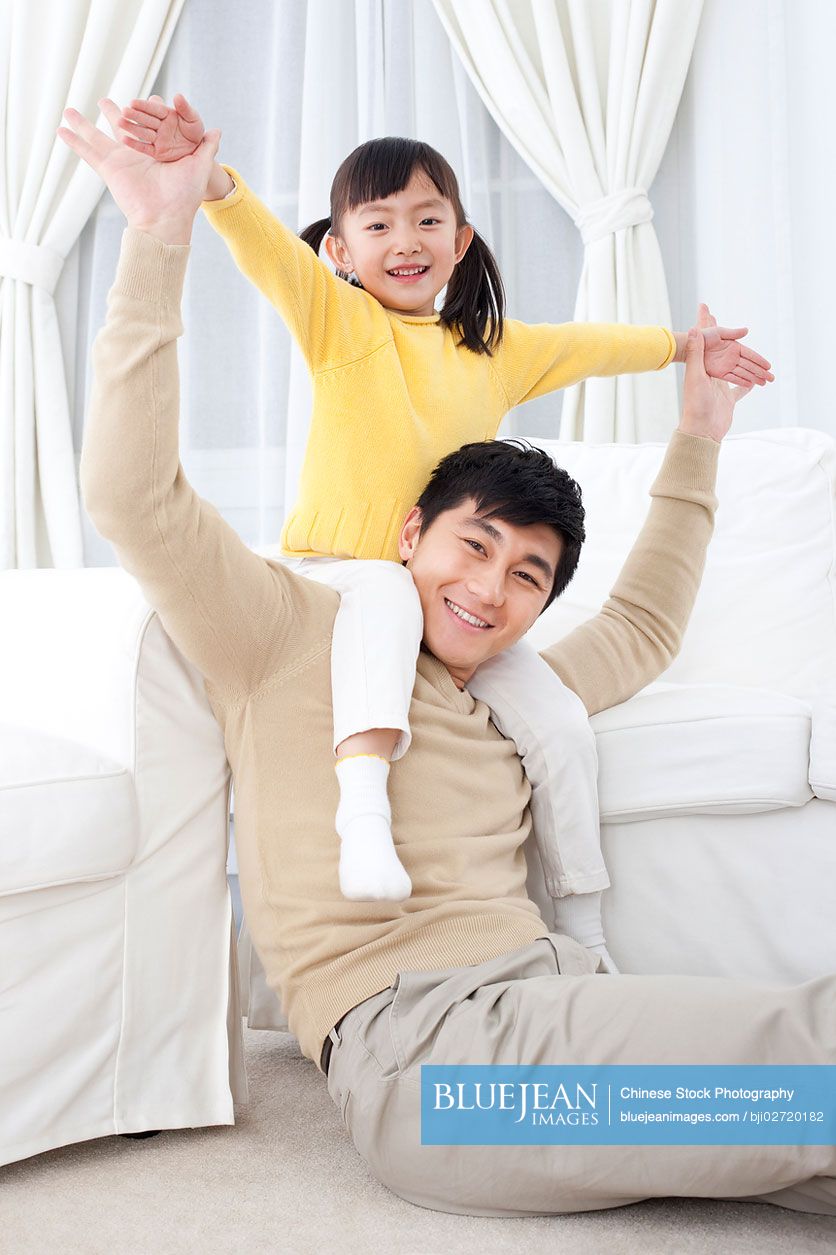 Chinese father playing with his daughter