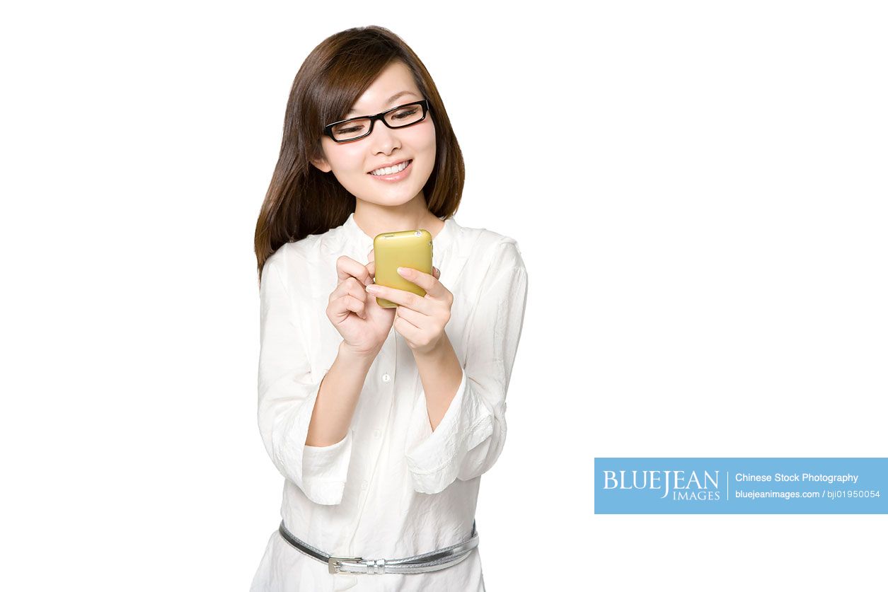 Portrait of young Chinese woman with mobile phone