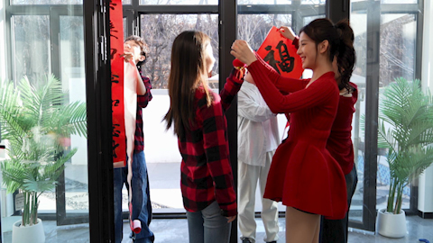 Young friends celebrating Chinese New Year together
