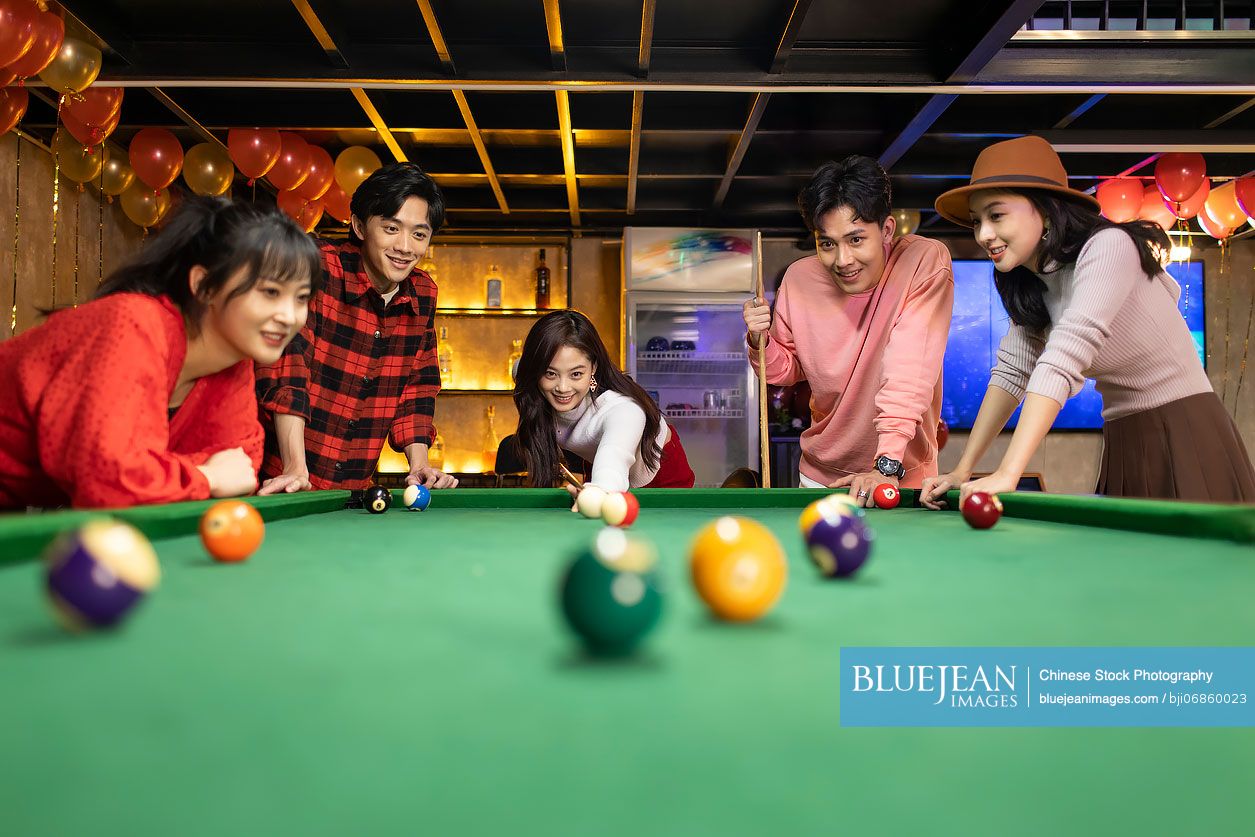 Friends play billiards., Stock image