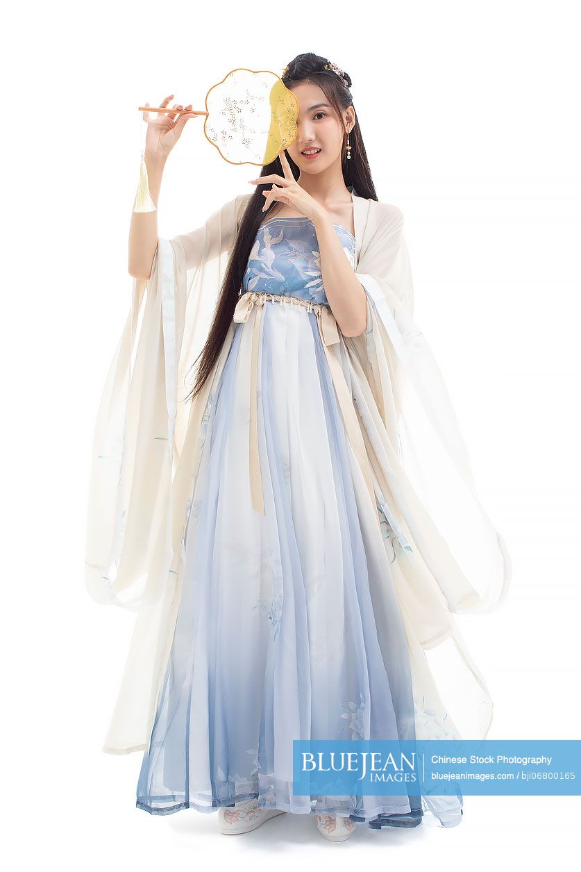 Beautiful young Chinese woman holding a round fan