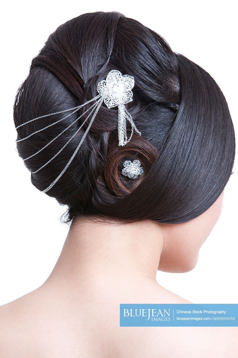 Young fair Chinese woman with ancient hairstyle, rear view