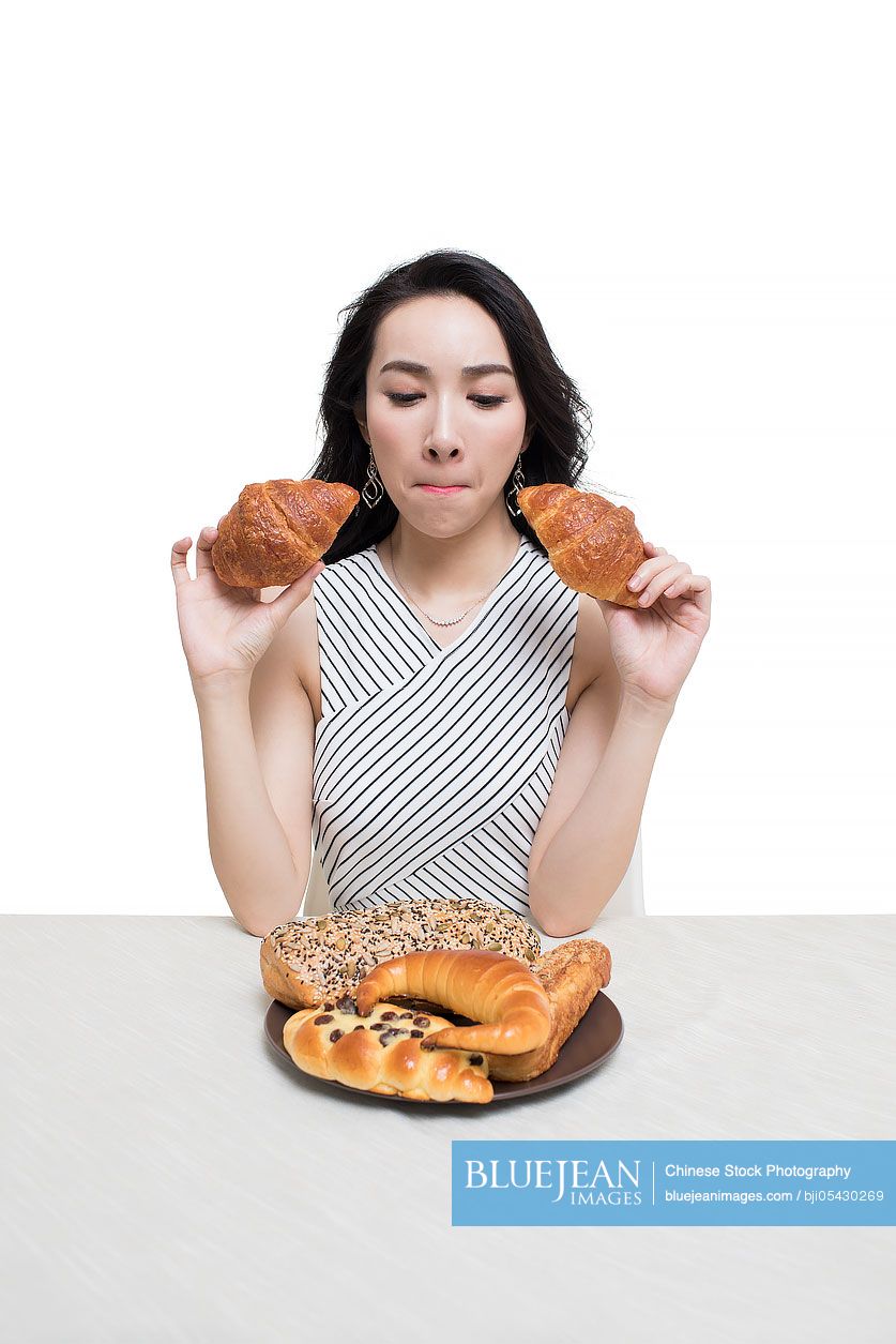 Fashionable young Chinese woman and bread