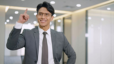 Chinese businessman thinking in empty office